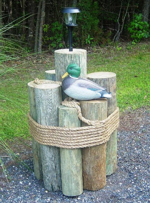 nautical-pilings-with-rope-arranged-to-hide-a-well-pipe